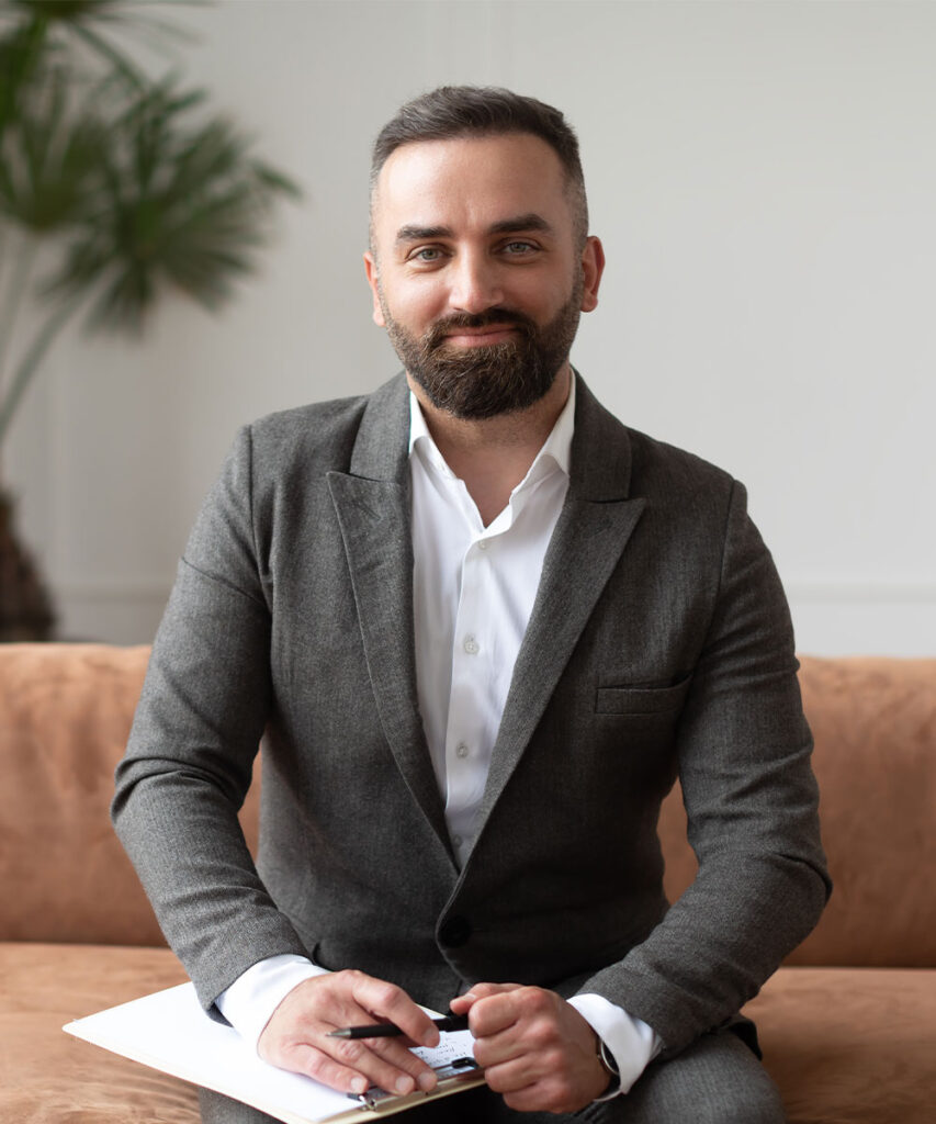 portrait of confident male therapist in suit sitti YNKQ6R6
